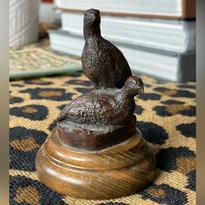 Bronze pair of quail figurines.  Numbered 77/1000 made.  Attached to wood stand
